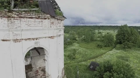 View of an abandoned old white Orthodox temple in the old village Stock Footage 338200474