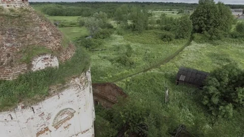 View of an abandoned old white Orthodox temple in the old village Stock Footage 338200497