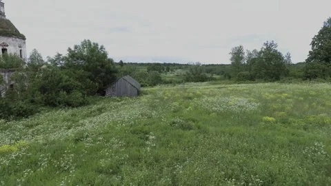 View of an abandoned old white Orthodox temple in the old village Stock Footage 338200500