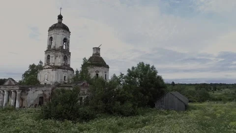 View of an abandoned old white Orthodox temple in the old village Stock Footage 338200514