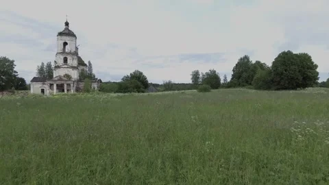 View of an abandoned old white Orthodox temple in the old village Stock Footage 338200573