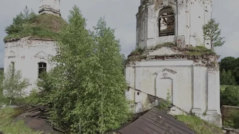 View of an abandoned old white Orthodox temple in the old village Stock Footage 338200689