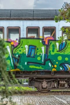 View of a abandoned older rustic train, wagon with graffiti street art Stock Photos