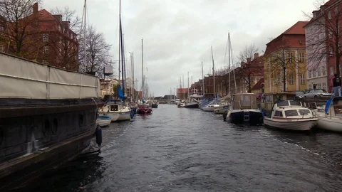 View from aBoat moving through canal in copenhagen Denamrk in the city centre. Video stock 98867795