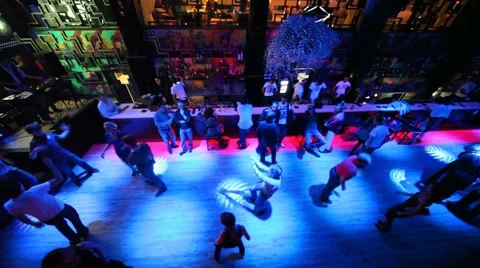 View from about on people dancing and sitting at bar in nightclub Video stock 947386
