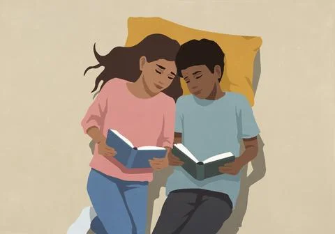 View from above of affectionate mother and son reading books on pillow Ilustração Stock
