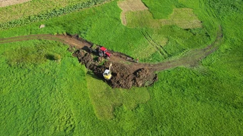 View from Above Of Backhoe Scooping Soil On The Field Stock Footage 260902939
