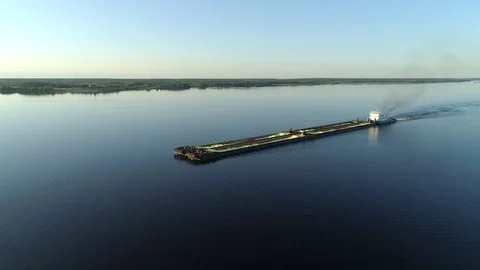 A view from above on a barge that goes on smooth water with a load Stock Footage 79221782
