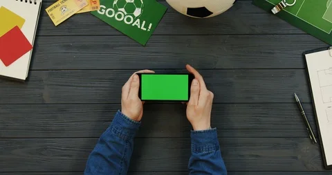 View from above on the black horizontal smartphone on the dark grey wooden desk 스톡 동영상 96334121