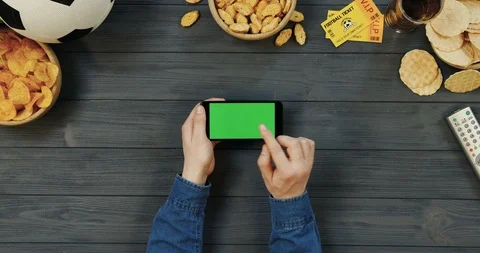 View from above on the black horizontal smartphone on the dark grey wooden table Stock Footage 96435391
