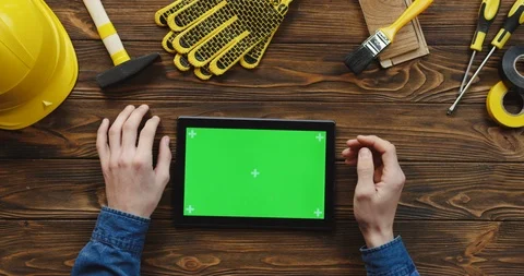 View from above on the black horizontal tablet computer on the wooden desk of 스톡 동영상 96183866
