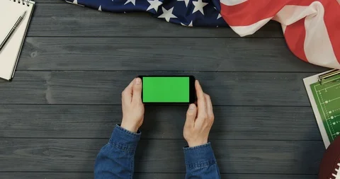 View from above on the black smartphone device lying horizontally on the dark Stock-Footage 96336818