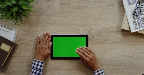 View from above on the black tablet computer lying horizontally on the wooden Stock Footage 96012987