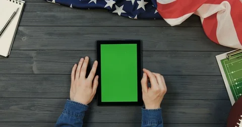 View from above on the black tablet computer lying vertically on the dark grey Stock Footage 96337194