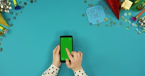 View from above on the black vertical smartphone lying on the blue table with Stock-Footage 89315569