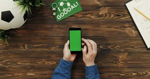 View from above on the black vertical smartphone with chroma key screen in hands Stock Footage 96319598