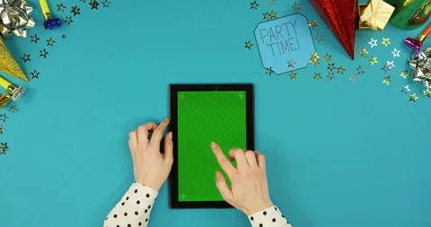 View from above on the black vertical tablet computer lying on the blue table Stock Footage 89314911
