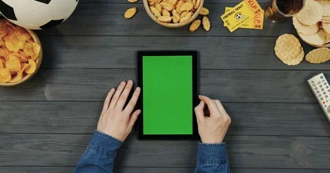 View from above on the black vertical tablet computer on the dark grey wooden Stock Footage 96431893