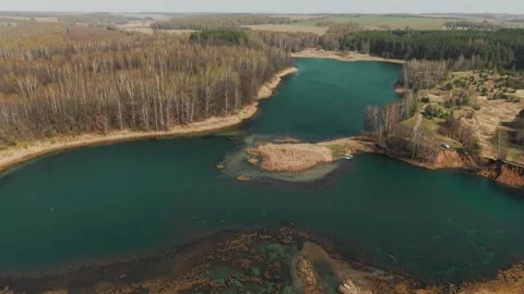 View from above on a blue lake, camera moves slowly, nature trip 動画素材 308907810