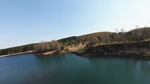 View from above on a blue lake, camera moves slowly, nature trip 動画素材 308907827