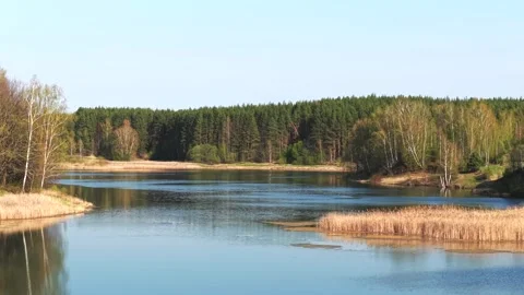 View from above on a blue lake, camera moves slowly, nature trip Stock Footage 308907867