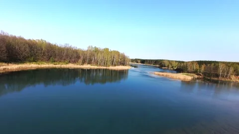View from above on a blue lake, camera moves slowly, nature trip Stock Footage 308907870