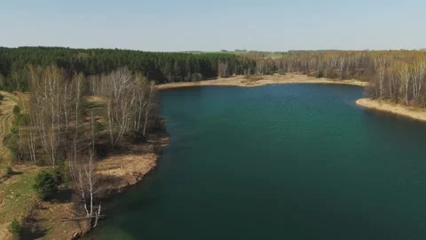View from above on a blue lake, camera moves slowly, nature trip Stock Footage 308907915