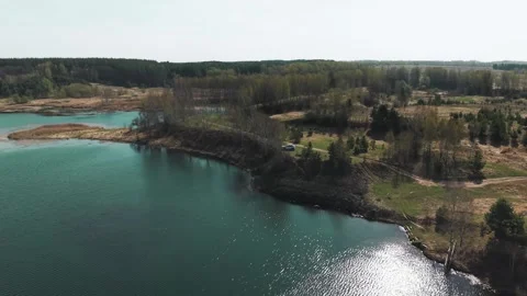 View from above on a blue lake, camera moves slowly, nature trip Stock Footage 308907927