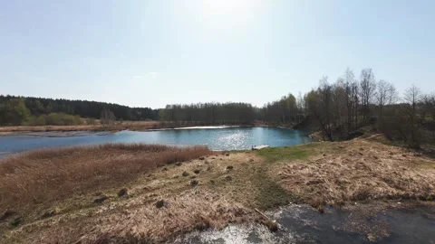 View from above on a blue lake, camera moves slowly, nature trip 動画素材 308907930