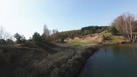 View from above on a blue lake, camera moves slowly, nature trip Stock Footage 308907933