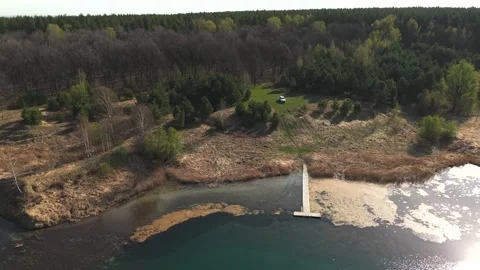 View from above on a blue lake, camera moves slowly, nature trip Stock Footage 308907944