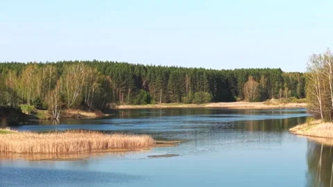 View from above on a blue lake, camera moves slowly, nature trip Stock Footage 308907961