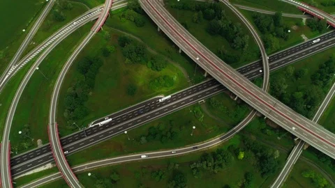 View from above circle ring multilevel road junction with busy traffic moving Stock Footage 111220647