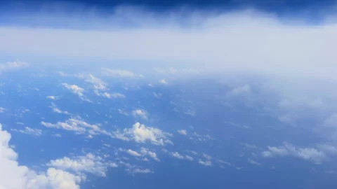View above the clouds from an airplane window Stock Footage 297520637