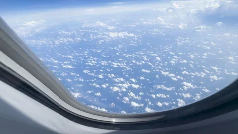 View above the clouds from an airplane window Stock Footage 297520770