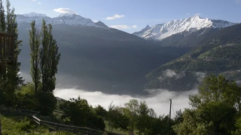 View above clouds onbeautiful  alpine mountains Stock Footage 109395128