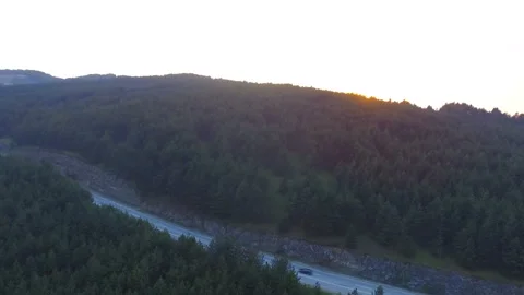 .View from above of coniferous forest in mountain at sunset. Transportation r Stock Footage 156466761