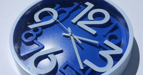 View from above. Cropped view of blue navy wall clock, isolated on a white Stock Footage 216344015