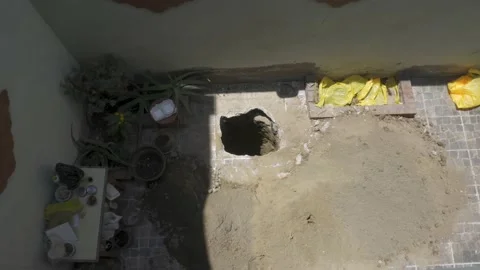 View from above of a deep hole made in the house floor Video stock 150669759