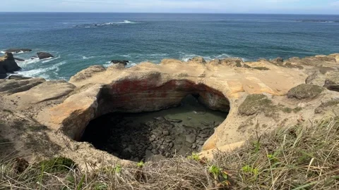 View from Above of Devil's Punchbowl on the Oregon Coast Stock Footage 314457296