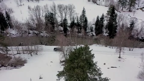 View from Above of Driving a Car in a Winter Paradise in the Mountains of Stock Footage 186755091