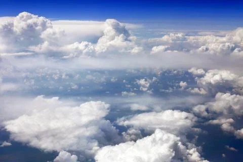 View above the earth at the clouds below. Stock Photos