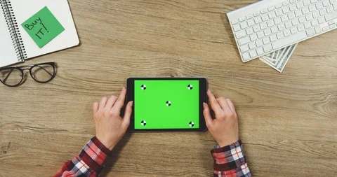 View from above on the female hands using the black horizontal tablet device Stock Footage 89957862