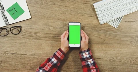 View from above on the female hands using the white vertical smartphone with a 스톡 동영상 89958415