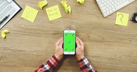 View from above on the female hands using the white vertical smartphone with a Stock-Footage 89965683