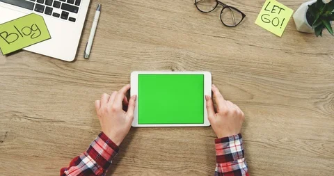 View from above on the female hands using the white horizontal tablet computer Stock Footage 89970658
