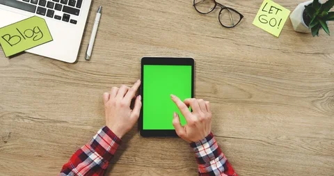 View from above on the female hands using the black vertical tablet computer Stock Footage 89971031