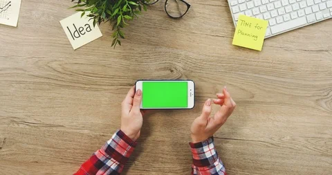 View from above on the female hands using the white horizontal smartphone with a Stock Footage 89975040