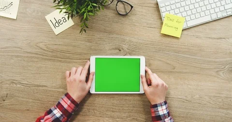 View from above on the female hands using the white horizontal tablet computer Stock-Footage 89976279