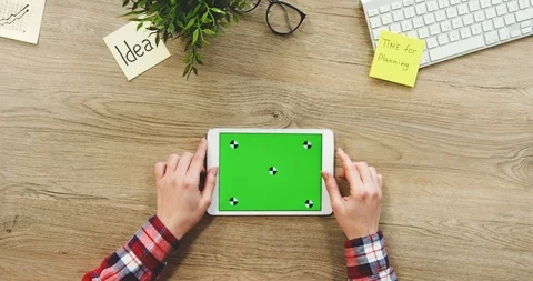 View from above on the female hands using the white horizontal tablet computer 스톡 동영상 89976404